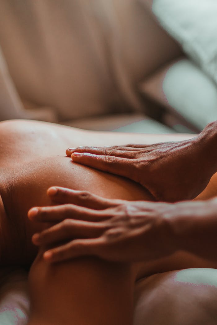 about-02 A soothing back massage session in a spa setting, focusing on wellness and relaxation.